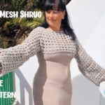 Woman modeling a beige crochet net mesh shrug with long sleeves over a matching dress. Text overlay reads "Net Mesh Shrug Free Pattern. Original design by Ariana of TheYarnCrew".